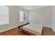 Bright bedroom with hardwood floors and a comfortable bed at 11708 Anglers Club Dr # 125, Placida, FL 33946