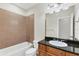 Simple bathroom with shower, granite vanity, and tile flooring at 11708 Anglers Club Dr # 125, Placida, FL 33946