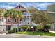 Two-story townhome with inviting front porch and lush landscaping at 11708 Anglers Club Dr # 125, Placida, FL 33946