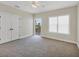 Bedroom with double doors, carpet, and access to balcony at 11708 Anglers Club Dr # 125, Placida, FL 33946