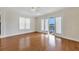 Hardwood floor bedroom with access to a deck and water views at 11708 Anglers Club Dr # 125, Placida, FL 33946