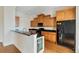 Modern kitchen with wood cabinets, granite counters and stainless steel appliances at 11708 Anglers Club Dr # 125, Placida, FL 33946