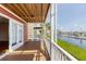 Covered balcony overlooking marina; view of water, boats, and landscaping at 11708 Anglers Club Dr # 125, Placida, FL 33946