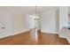 Hardwood floor dining room with chandelier and adjacent to kitchen at 11708 Anglers Club Dr # 125, Placida, FL 33946