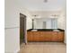 Bathroom boasts double sinks, granite countertops, and tiled floors at 11708 Anglers Club Dr # 125, Placida, FL 33946