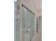 Modern bathroom with glass enclosed toilet and marble floors at 118 Green Pine Park, Rotonda West, FL 33947