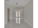 Modern entryway with marble floors and double doors at 118 Green Pine Park, Rotonda West, FL 33947