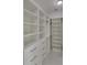 Large walk-in closet with ample shelving and drawers at 118 Green Pine Park, Rotonda West, FL 33947