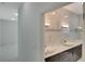 Elegant bathroom with marble tile and double vanity at 118 Green Pine Park, Rotonda West, FL 33947