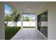 Covered patio with access to backyard and sliding doors at 118 Green Pine Park, Rotonda West, FL 33947