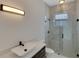 Modern bathroom with marble shower and floating vanity at 118 Green Pine Park, Rotonda West, FL 33947