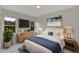 Bedroom with wood dresser and large windows at 118 Green Pine Park, Rotonda West, FL 33947