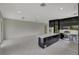 Open concept kitchen with island, black cabinets, and marble floors at 118 Green Pine Park, Rotonda West, FL 33947