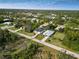 Aerial view showcasing a residential neighborhood with a focus on a single-Gathering home at 118 Green Pine Park, Rotonda West, FL 33947