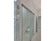 Modern bathroom with glass enclosed toilet and marble floors at 118 Green Pine Park, Rotonda West, FL 33947