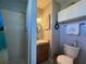Clean bathroom with shower, vanity, and toilet at 8934 Gulf St, Placida, FL 33946