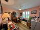Cozy bedroom with hardwood floors and built-in shelving at 8934 Gulf St, Placida, FL 33946