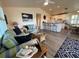Living area with sofa, coffee table, and kitchen views at 8934 Gulf St, Placida, FL 33946