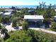 Aerial view showcasing an elevated home near the ocean at 8934 Gulf St, Placida, FL 33946