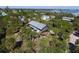 Two story home with large deck and tropical landscaping at 8934 Gulf St, Placida, FL 33946