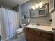 Clean bathroom with shower/tub combo, vanity, and toilet at 8934 Gulf St, Placida, FL 33946