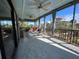 Spacious, screened porch with comfortable seating and ceiling fans at 8934 Gulf St, Placida, FL 33946