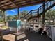 Spacious deck with outdoor sink and seating at 8934 Gulf St, Placida, FL 33946
