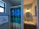Small bathroom with shower and vanity at 8934 Gulf St, Placida, FL 33946