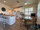 Kitchen with island, white cabinets, and dining area at 8934 Gulf St, Placida, FL 33946