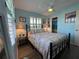 Bedroom with patchwork quilt and ensuite bathroom at 8934 Gulf St, Placida, FL 33946