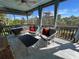 Relaxing screened porch with seating and outdoor views at 8934 Gulf St, Placida, FL 33946