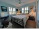 Bedroom with patchwork quilt and ensuite bathroom at 8934 Gulf St, Placida, FL 33946