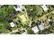 Aerial view of a single-Gathering home on a tree-lined street, close to the beach at 8934 Gulf St, Placida, FL 33946