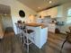 Modern kitchen with island and white cabinets at 8934 Gulf St, Placida, FL 33946