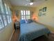 Bedroom with starfish bedding and window shutters at 8934 Gulf St, Placida, FL 33946