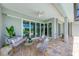 Relaxing patio with seating area and view of the pool at 777 Boundary Blvd, Rotonda West, FL 33947