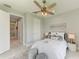 Bedroom with queen bed, and access to the bathroom and hallway at 777 Boundary Blvd, Rotonda West, FL 33947