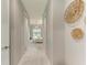 Bright hallway with light walls and wood-look flooring at 777 Boundary Blvd, Rotonda West, FL 33947
