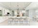 Modern white kitchen with stainless steel appliances and large island at 777 Boundary Blvd, Rotonda West, FL 33947