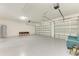 Spacious garage with epoxy flooring and room for multiple vehicles at 779 Boundary Blvd, Rotonda West, FL 33947