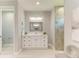 Bathroom with white vanity and walk-in shower at 779 Boundary Blvd, Rotonda West, FL 33947