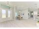 Open concept dining area with light wood table and gray chairs at 779 Boundary Blvd, Rotonda West, FL 33947