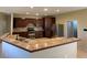 Modern kitchen with dark wood cabinets and granite countertops at 6 Transon Ln, Placida, FL 33946