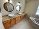 Primary bathroom with double sinks, soaking tub and separate shower at 6 Transon Ln, Placida, FL 33946