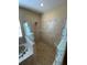 Walk-in shower with glass block accents and tiled walls at 6 Transon Ln, Placida, FL 33946