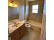 Clean bathroom, bathtub, and vanity with wood cabinets at 6 Transon Ln, Placida, FL 33946