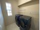Laundry room with washer, dryer, and ample shelving at 6 Transon Ln, Placida, FL 33946