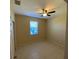 Bright bedroom with tile floors and ceiling fan at 6 Transon Ln, Placida, FL 33946