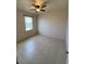 Bright bedroom with ceiling fan and large window at 6 Transon Ln, Placida, FL 33946