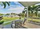 Relaxing back porch overlooking the backyard and waterfront at 10470 Sunny Dreams Ter, Placida, FL 33946